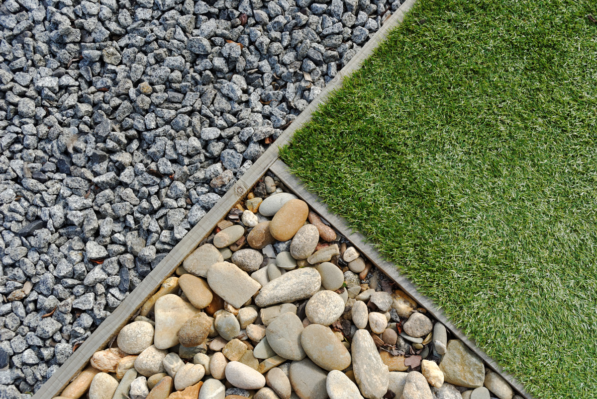 Different types of rocks and grass in a Carlsbad landscape.
